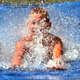 A child enjoys a non-ultimate, hopefully non-giardia-infected slip 'n slide